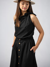 Load image into Gallery viewer, Swahlee creates a handmade capsule wardrobe of clothing essentials made in India using sustainable production and natural fabrics. The Button Midi Skirt in Black.
