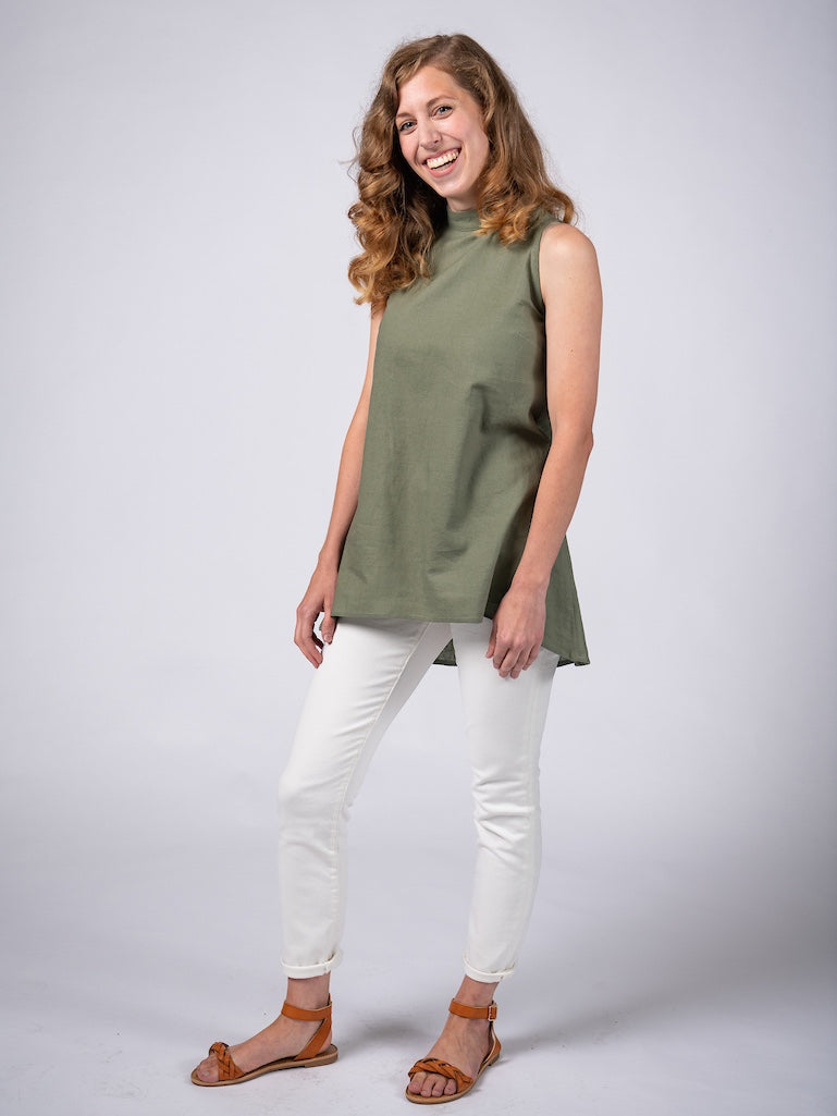 Swahlee creates a handmade capsule wardrobe of clothing essentials made in India using sustainable production and natural fabrics. The Stand Collar Tunic in Sage Green.