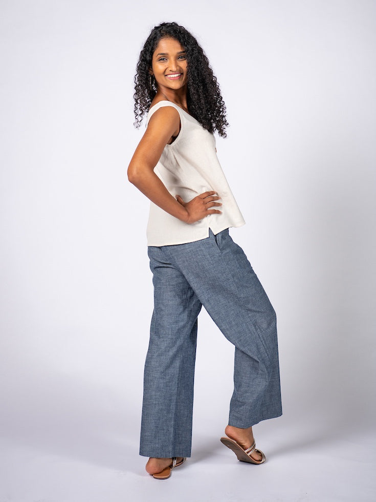 Swahlee creates a handmade capsule wardrobe of clothing essentials made in India using sustainable production and natural fabrics. The Wide Leg Trousers in Chambray.