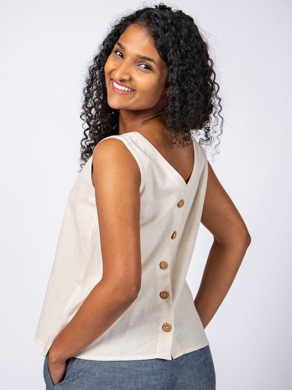 Swahlee creates a handmade capsule wardrobe of clothing essentials made in India using sustainable production and natural fabrics. The Sleeveless Reversible Top in Natural Cotton Linen.