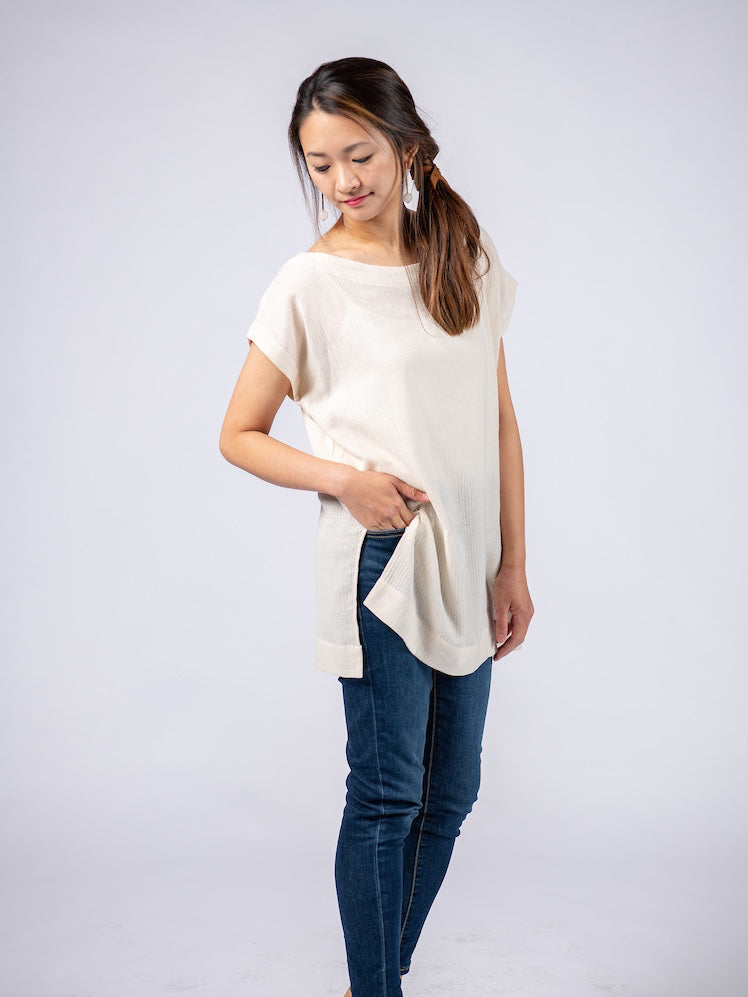 Swahlee creates a handmade capsule wardrobe of clothing essentials made in India using sustainable production and natural fabrics. The Kaftan Tunic in Sheer Striped Natural. 