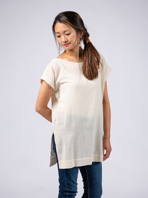 Swahlee creates a handmade capsule wardrobe of clothing essentials made in India using sustainable production and natural fabrics. The Kaftan Tunic in Sheer Striped Natural.