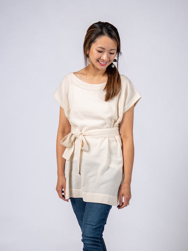 Swahlee creates a handmade capsule wardrobe of clothing essentials made in India using sustainable production and natural fabrics. The Kaftan Tunic in Sheer Striped Natural. 