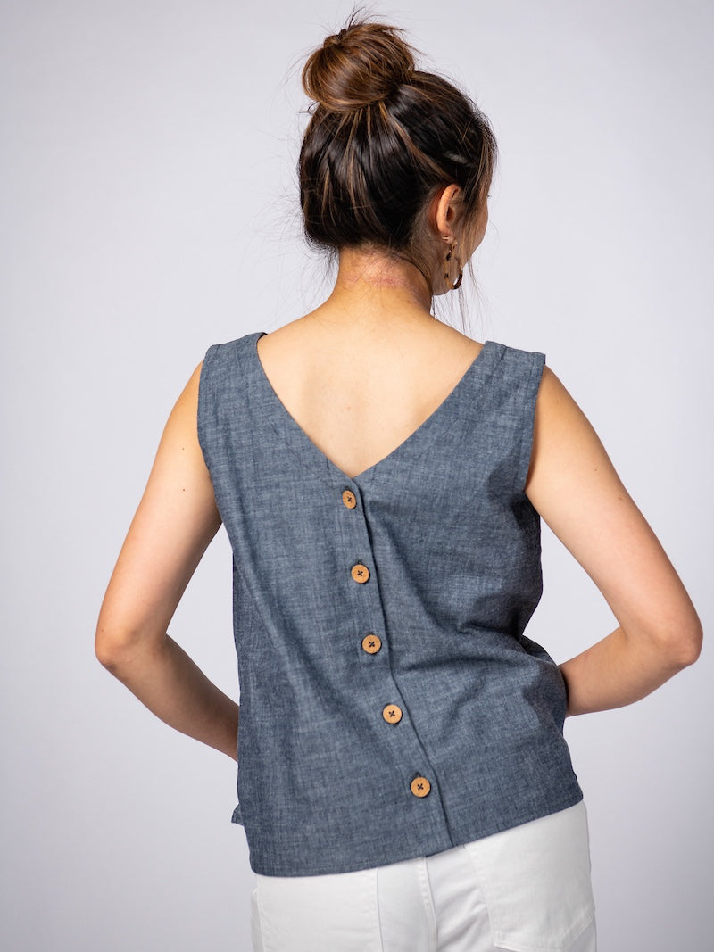 Swahlee creates a handmade capsule wardrobe of clothing essentials made in India using sustainable production and natural fabrics. The Sleeveless Reversible Top in Chambray Cotton.