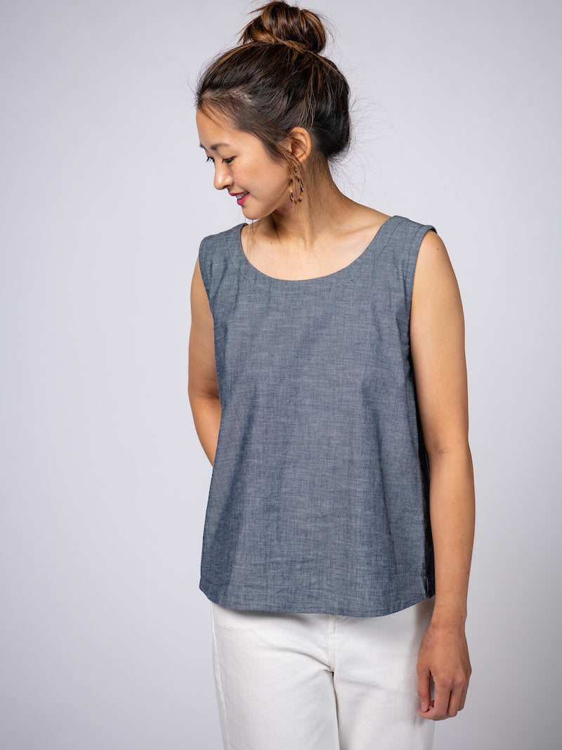 Swahlee creates a handmade capsule wardrobe of clothing essentials made in India using sustainable production and natural fabrics. The Sleeveless Reversible Top in Chambray Cotton. 