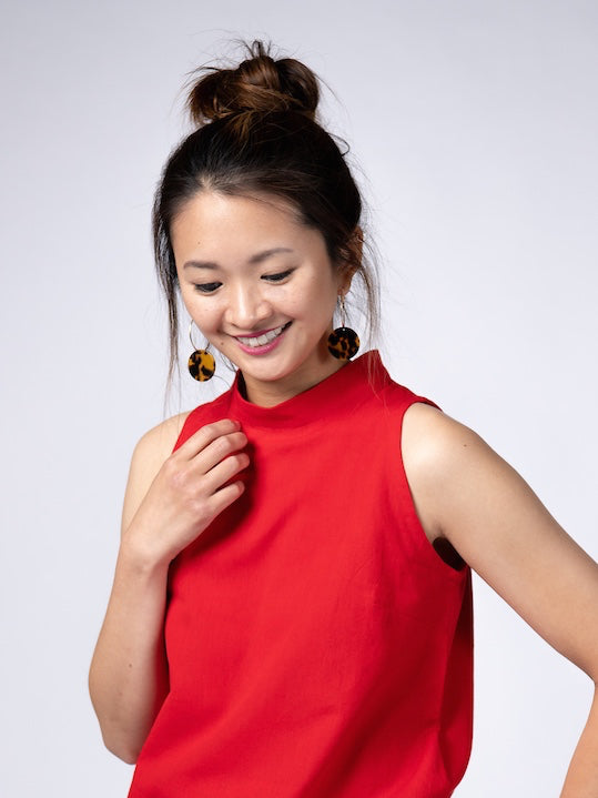 Swahlee creates a handmade capsule wardrobe of clothing essentials made in India using sustainable production and natural fabrics. The Stand Collar Tunic in Red.