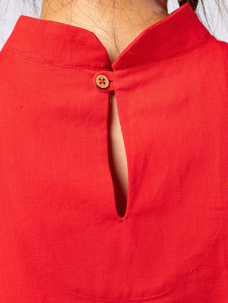 Swahlee creates a handmade capsule wardrobe of clothing essentials made in India using sustainable production and natural fabrics. the Stand Collar Tunic in Red. Coconut button detail. 