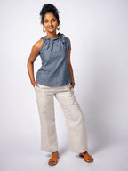 Swahlee creates a handmade capsule wardrobe of clothing essentials made in India using sustainable production and natural fabrics. The Tie-Neck Halter Top in Chambray. 