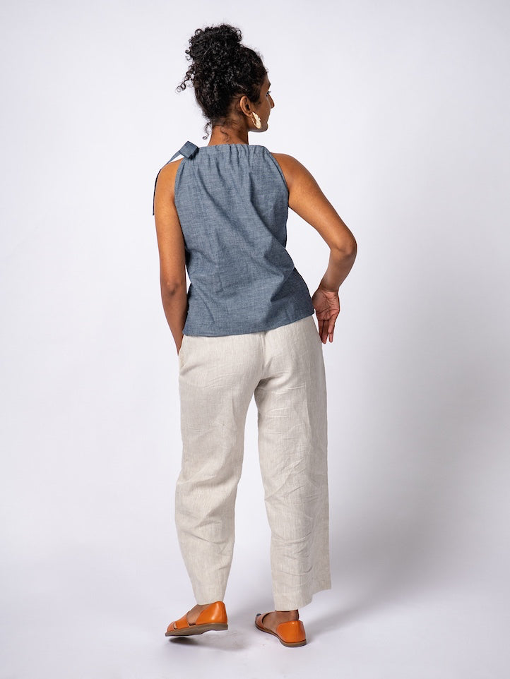 Swahlee creates a handmade capsule wardrobe of clothing essentials made in India using sustainable production and natural fabrics. The Wide Leg Trousers in Natural Linen. 