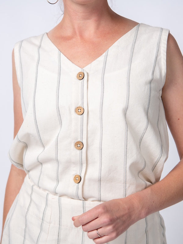 Swahlee creates a handmade capsule wardrobe of clothing essentials made in India using sustainable production and natural fabrics. The Sleeveless Reversible Top in Natural with Sage Stripes Handloom Cotton.