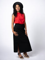Swahlee creates a handmade capsule wardrobe of clothing essentials made in India using sustainable production and natural fabrics. The Wrap Maxi Skirt in Black.