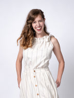 Swahlee creates a handmade capsule wardrobe of clothing essentials made in India using sustainable production and natural fabrics. The Tie-Neck Halter Top in Natural with Sage Stripes.