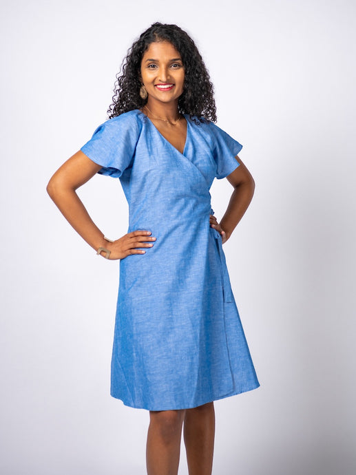 Swahlee creates a handmade capsule wardrobe of clothing essentials made in India using sustainable production and natural fabrics. The Wrap Dress in True Blue.