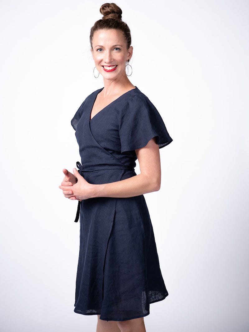 Swahlee creates a handmade capsule wardrobe of clothing essentials made in India using sustainable production and natural fabrics. The Wrap Dress in Navy.