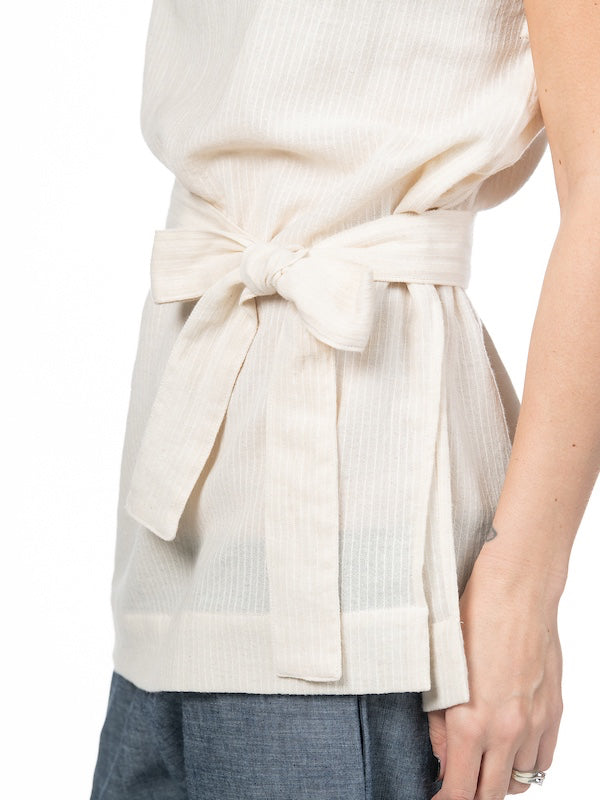 Swahlee creates a handmade capsule wardrobe of clothing essentials made in India using sustainable production and natural fabrics. The Kaftan Tunic in Sheer Striped Natural.