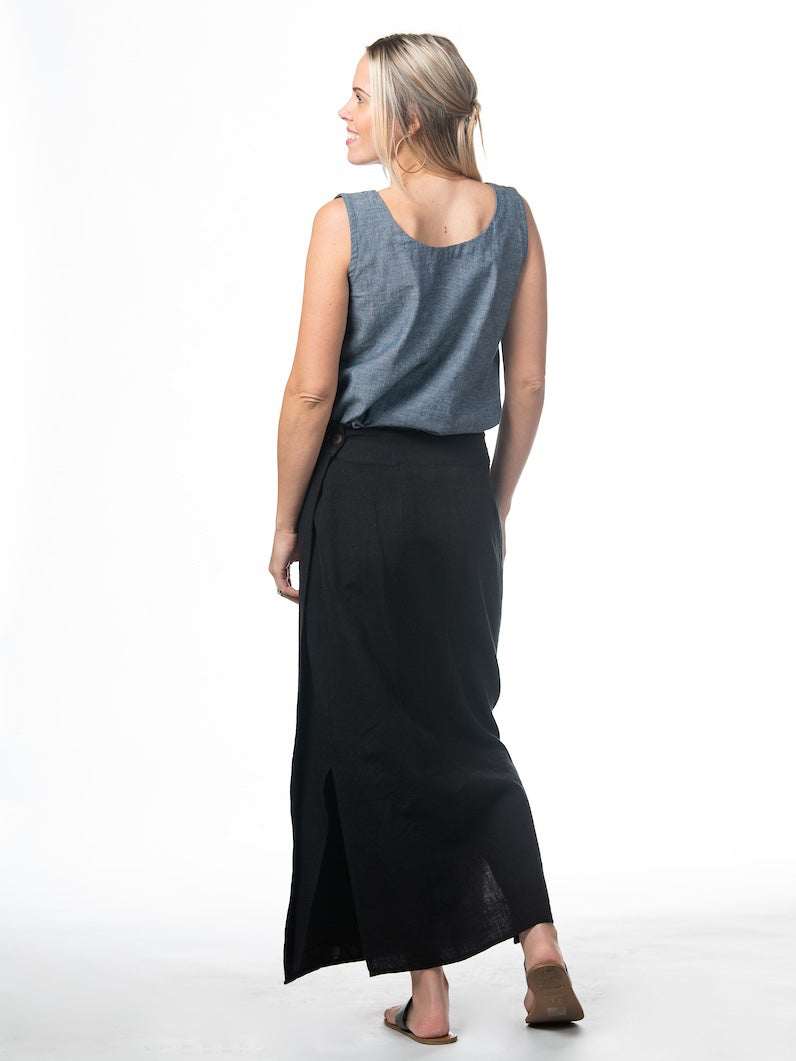 Swahlee creates a handmade capsule wardrobe of clothing essentials made in India using sustainable production and natural fabrics. The Wrap Maxi Skirt in Black.