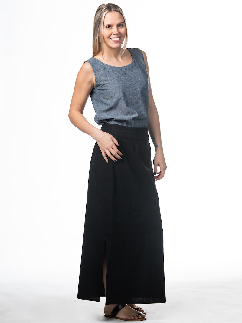 Swahlee creates a handmade capsule wardrobe of clothing essentials made in India using sustainable production and natural fabrics. The Wrap Maxi Skirt in Black.