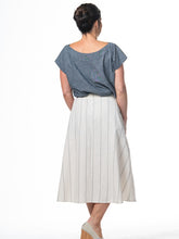 Load image into Gallery viewer, Swahlee creates a handmade capsule wardrobe of clothing essentials made in India using sustainable production and natural fabrics. The Button Midi Skirt in Natural with Sage Stripes.
