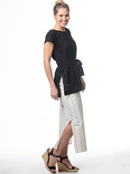 Swahlee creates a handmade capsule wardrobe of clothing essentials made in India using sustainable production and natural fabrics. The Wrap Maxi Skirt in Natural with Sage Stripes.