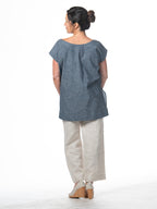 Swahlee creates a handmade capsule wardrobe of clothing essentials made in India using sustainable production and natural fabrics. The Kaftan Tunic in Chambray. 