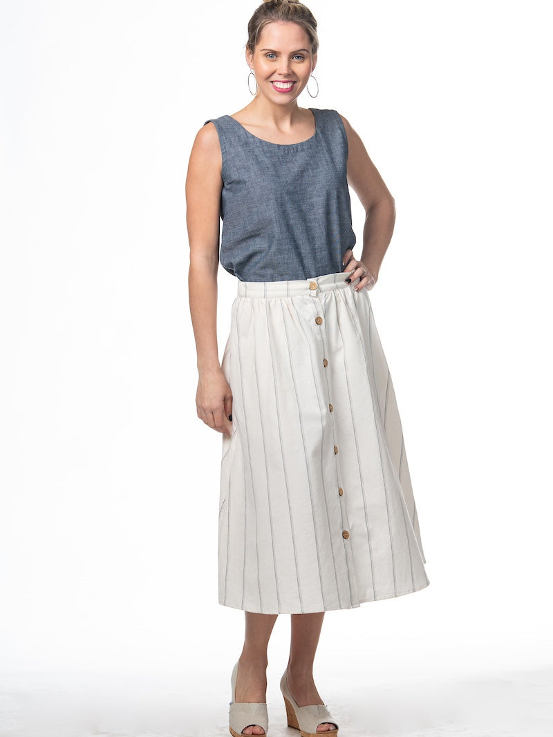 Swahlee creates a handmade capsule wardrobe of clothing essentials made in India using sustainable production and natural fabrics. The Button Midi Skirt in Natural with Sage Stripes.