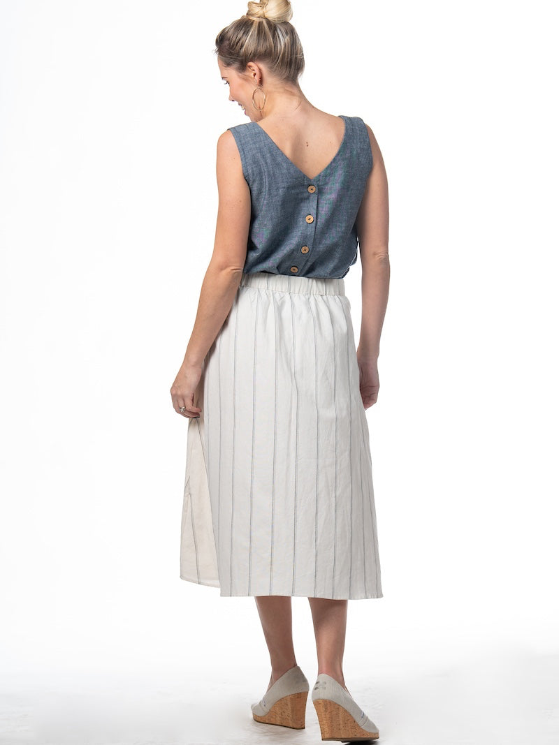Swahlee creates a handmade capsule wardrobe of clothing essentials made in India using sustainable production and natural fabrics. The Button Midi Skirt in Natural with Sage Stripes.
