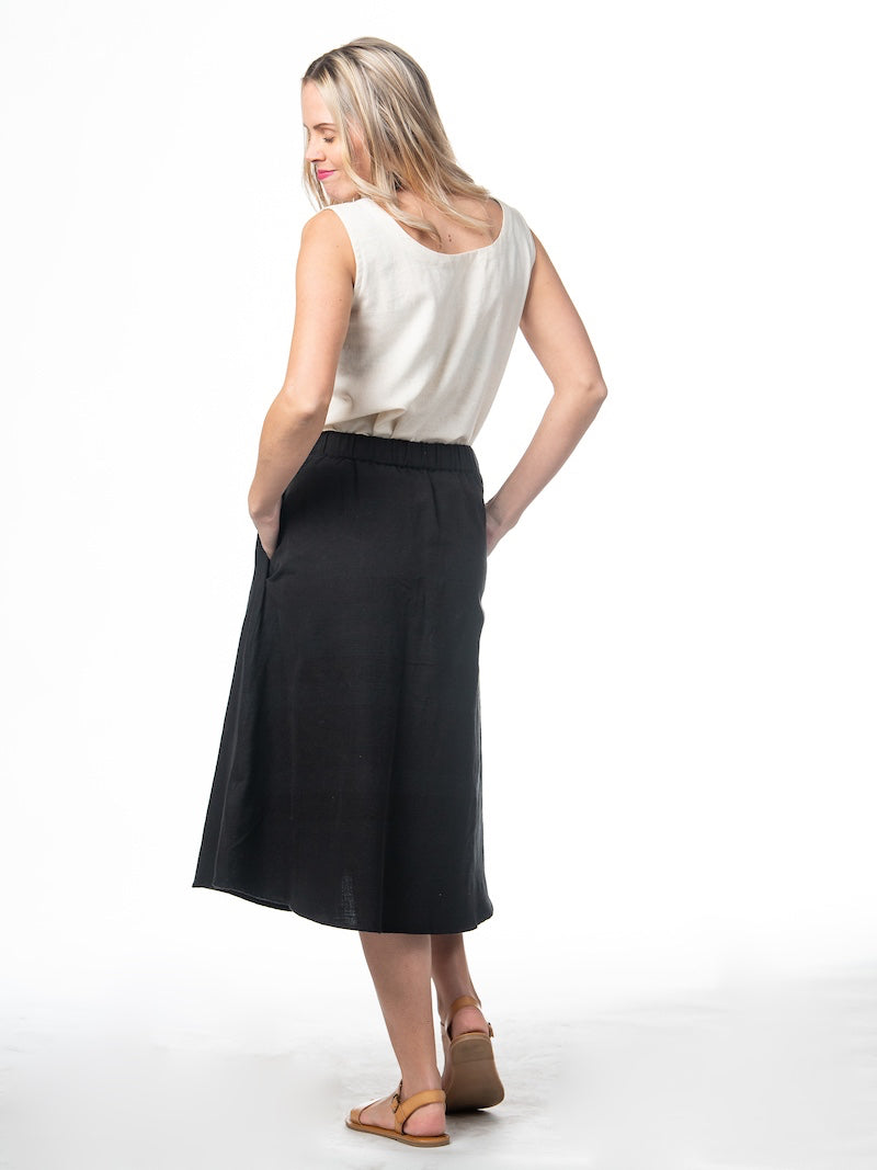 Swahlee creates a handmade capsule wardrobe of clothing essentials made in India using sustainable production and natural fabrics. The Sleeveless Reversible Top in Natural Cotton Linen.