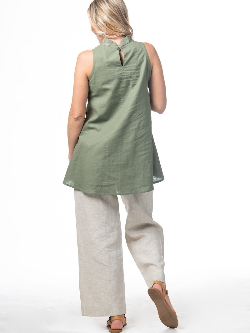 Swahlee creates a handmade capsule wardrobe of clothing essentials made in India using sustainable production and natural fabrics. The Stand Collar Tunic in Sage Green.