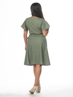 Swahlee creates a handmade capsule wardrobe of clothing essentials made in India using sustainable production and natural fabrics. The Wrap Dress in Sage Green.