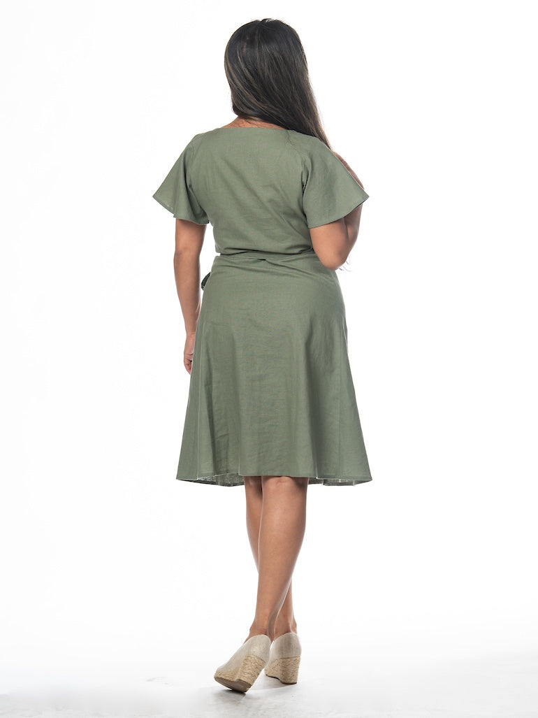 Swahlee creates a handmade capsule wardrobe of clothing essentials made in India using sustainable production and natural fabrics. The Wrap Dress in Sage Green.
