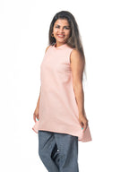 Swahlee creates a handmade capsule wardrobe of clothing essentials made in India using sustainable production and natural fabrics. The Stand Collar Tunic in Pink.