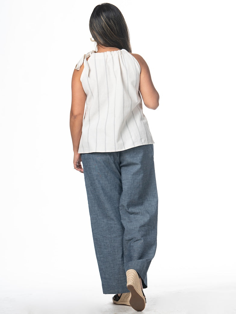 Swahlee creates a handmade capsule wardrobe of clothing essentials made in India using sustainable production and natural fabrics. The Tie-Neck Halter Top in Natural with Sage Stripes. 